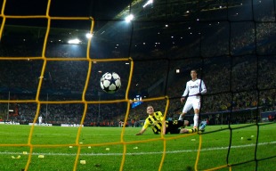 Real Madrid's Ronaldo scores a goal past Borussia Dortmund's Lukasz Pisczek in Champions League semi-final first leg soccer match in Dortmund